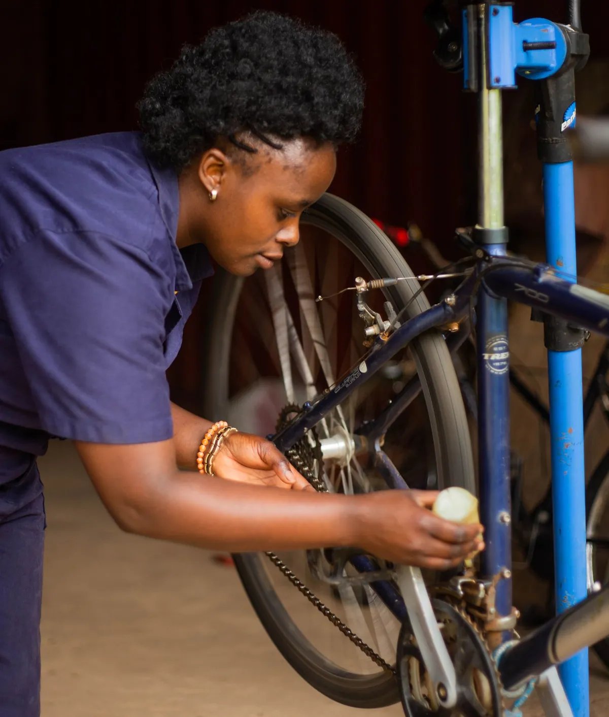 Mechanic repairing a bike in a workshop